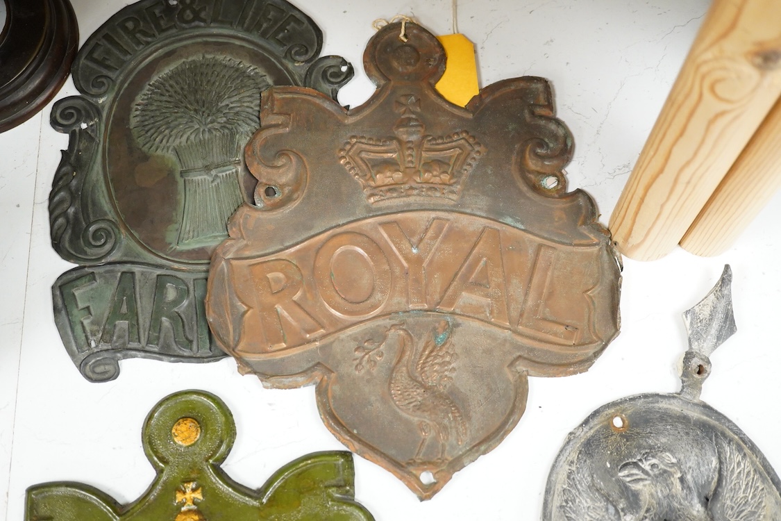 A collection of plaques to include a lead example and two copper examples one ‘Fire & Life, Farmers’, largest 30cm high